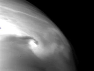 A vortex in the Venusian clouds. Although similar vortices are seen in our planet’s atmosphere, it’s the first time such a feature was spotted on Venus. (Image: JAXA)
